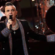 Robbie Williams en un concierto en directo